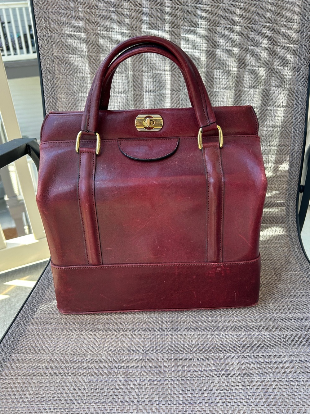 Vintage ox blood colored doctors bag style handbag. Velvet interior.